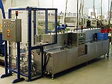 Durchlaufanlage TW 103 – verkettete Reinigungsanlage für Schließzylinder Komplette Durchlaufanlage TW 103 mit verketteter Reinigungs- und Transporteinheit