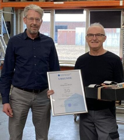Zbigniew Woch is honored for 30 years of service at PERKUTE
